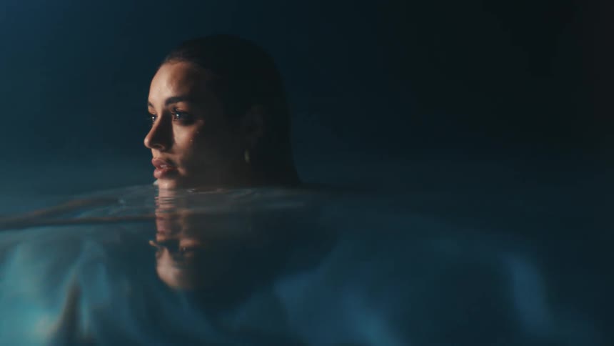 A woman is talking in the pool