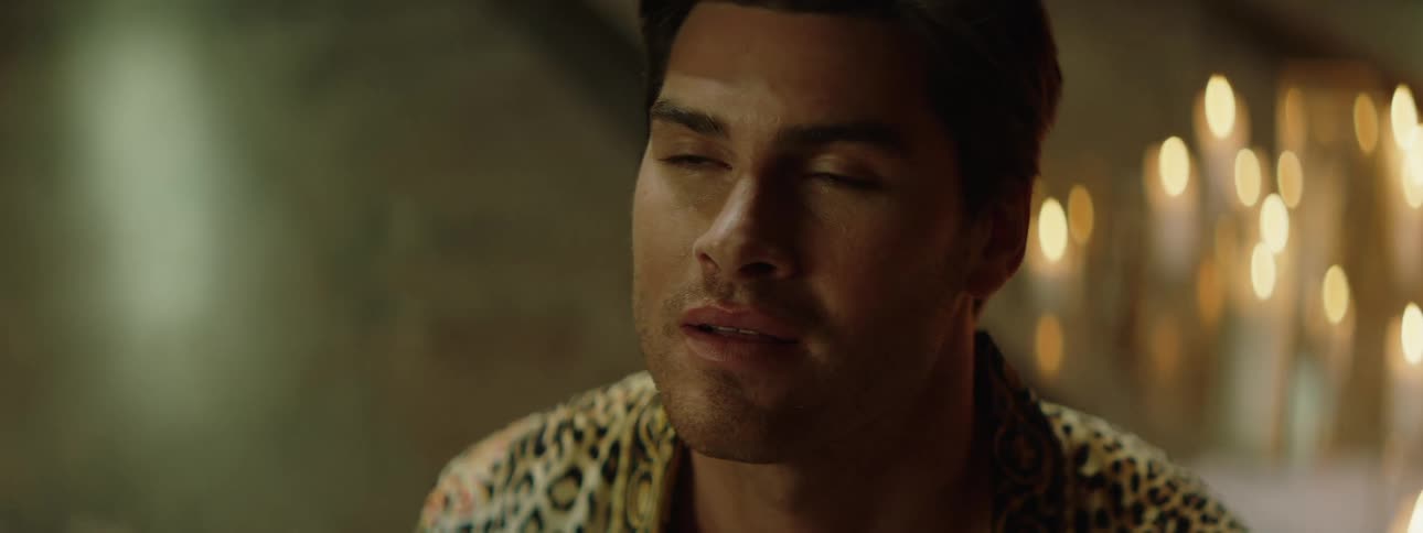 A man in soft light appears thoughtful in a closeup hinting at quiet reflection