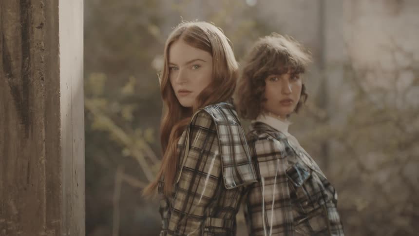 Two women are wearing matching clothing