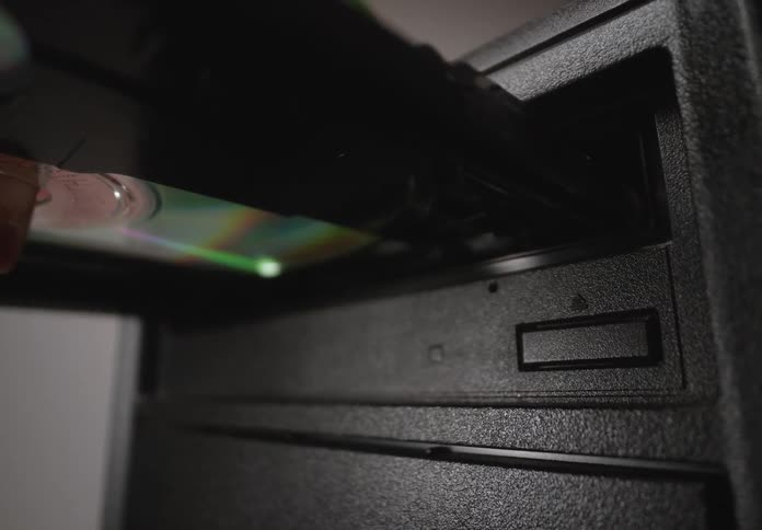 Finger clicking a button and opening a cd case