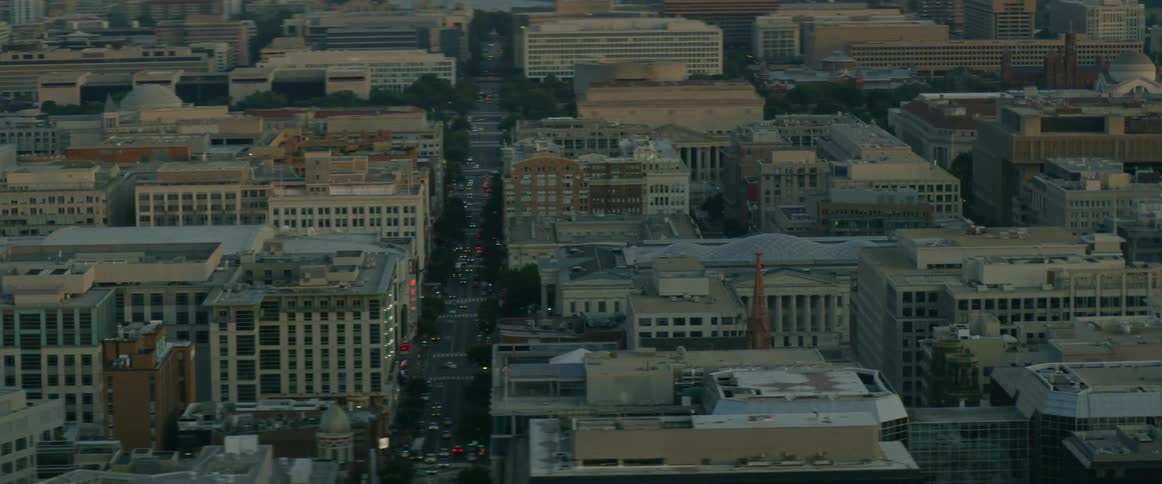 Buildings and streets in a large city in the evening