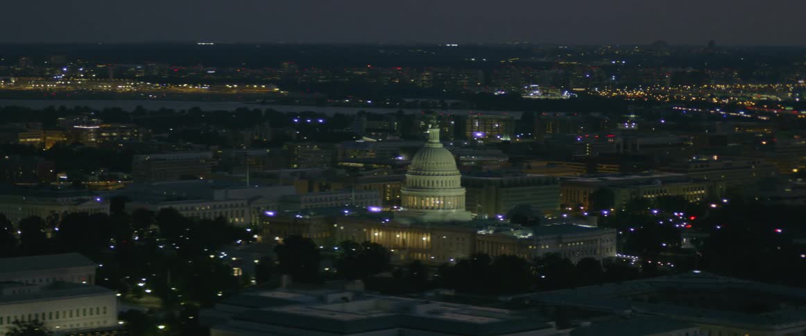 The city below is lit up at night