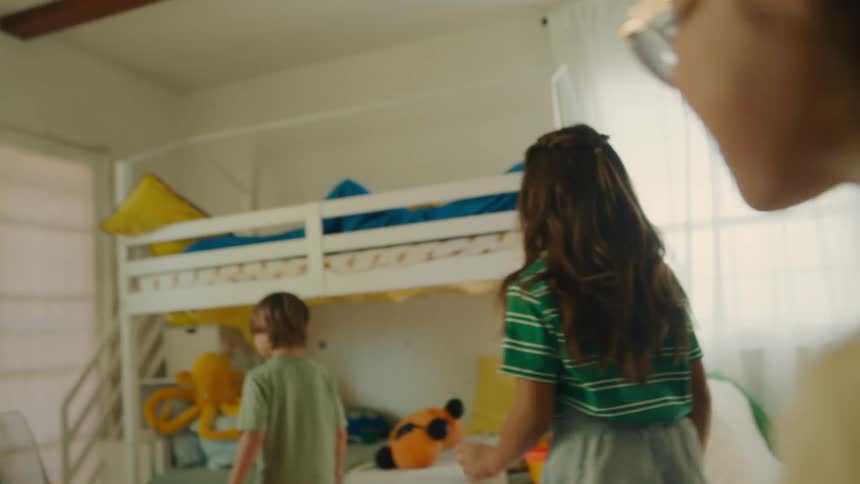 Children play in the bedroom together