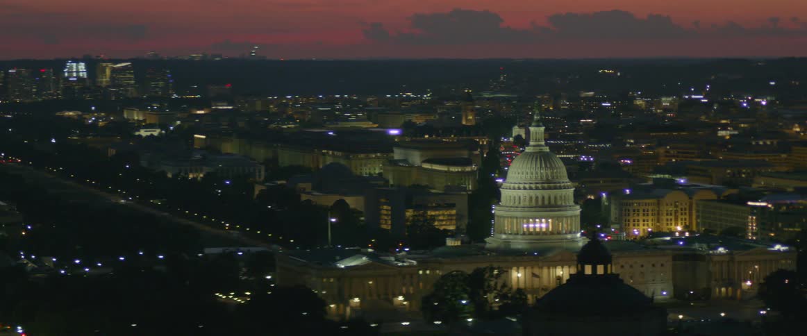 The capitol building and washington monument at sunset