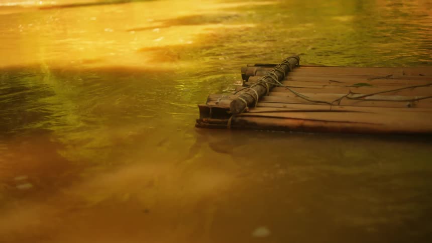 Handmade bamboo block floating in a river