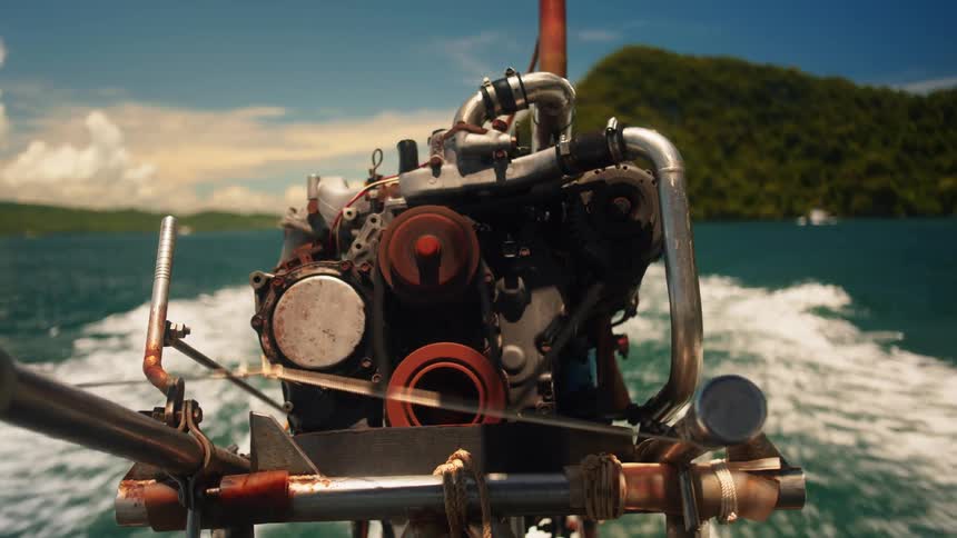 A boat with a makeshift engine is moving through the water