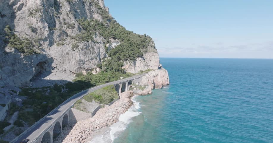 Traffic flows on the road by the ocean