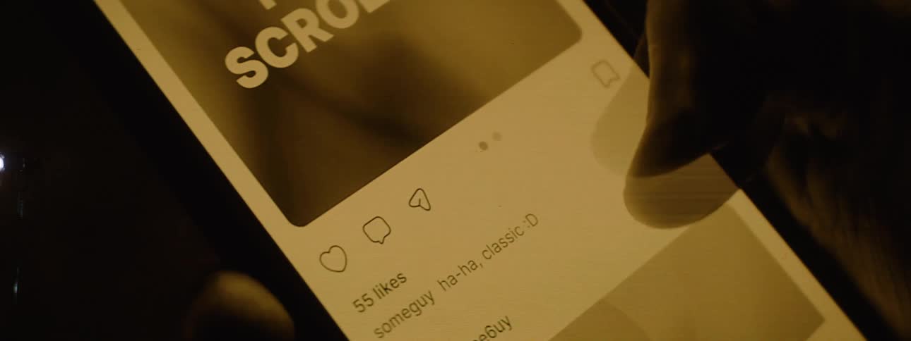 A person is scrolling a feed on their cell phone