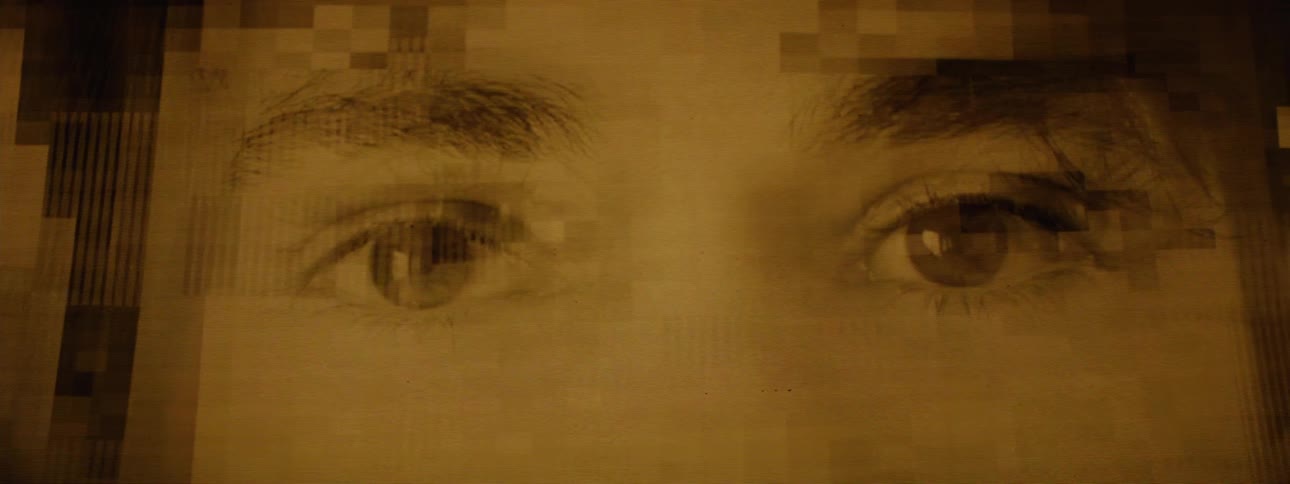 Flashes of at least two people move fast showing only the top of their faces