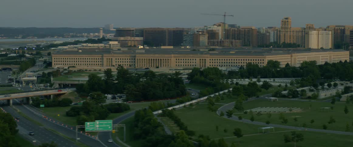 City buildings are shown in the distance