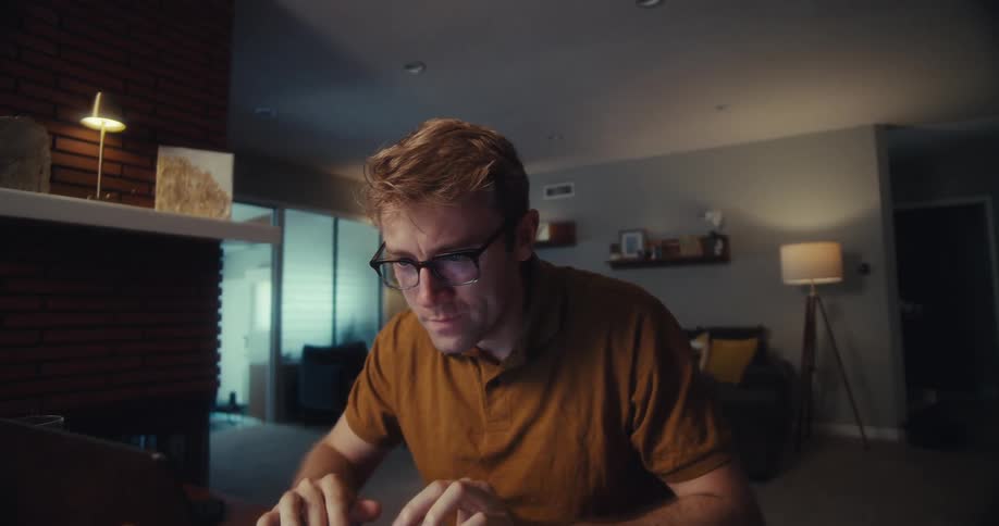 A close up clip of a man working indoor