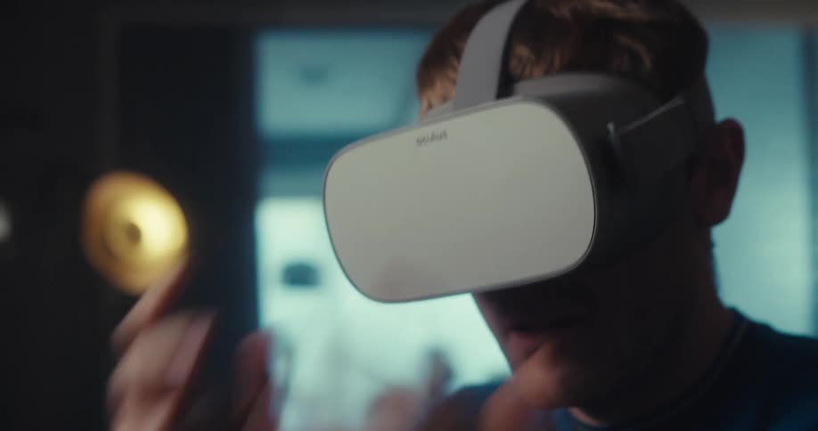 A footage of a man playing virtual reality