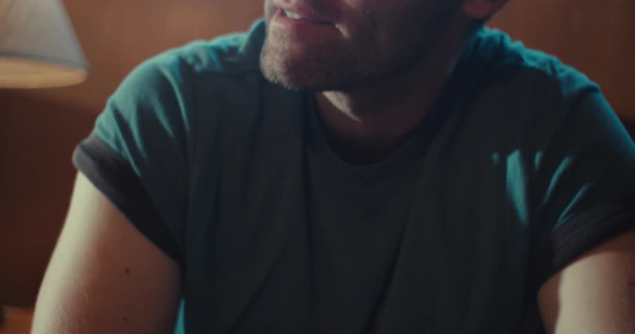 Man gestures during a discussion in the living room