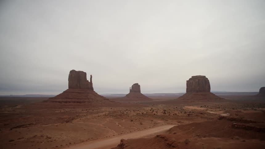 The canyons ahead are under a cloudy sky