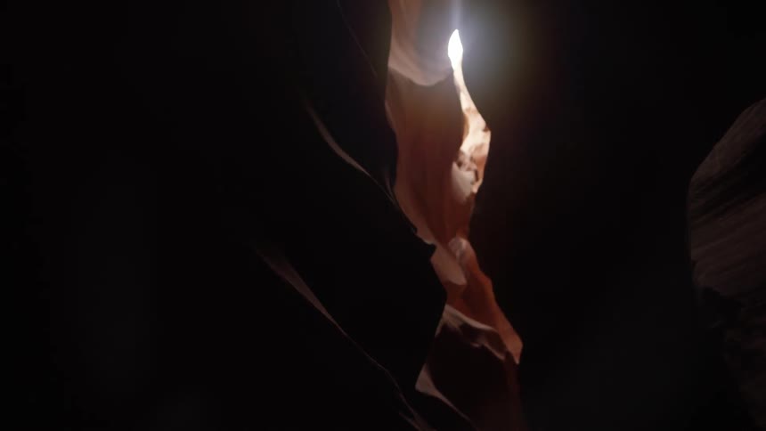 The sun peeks through a narrow cavern