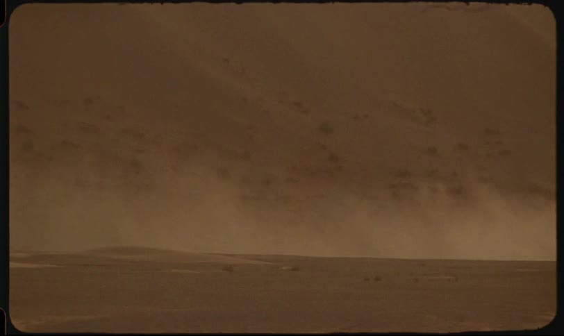 Dense fog obscures a mostly flat landscape