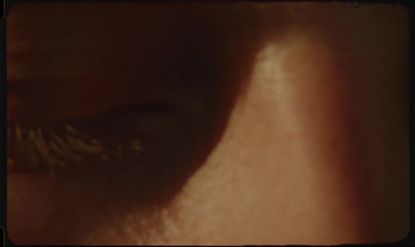 Closeup of closed eyes and a woman with reflection of the sun