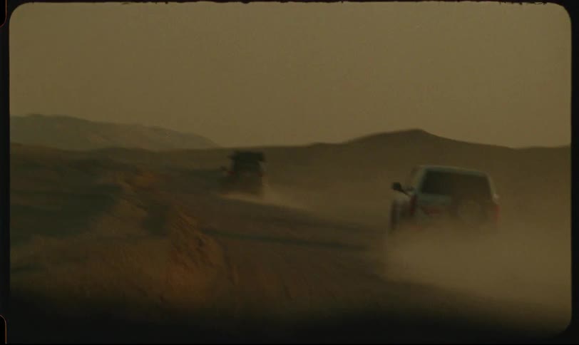 4x4 cars traveling through the desert and making sand fly