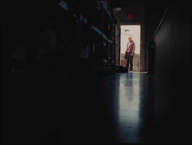 A woman entering a changing room