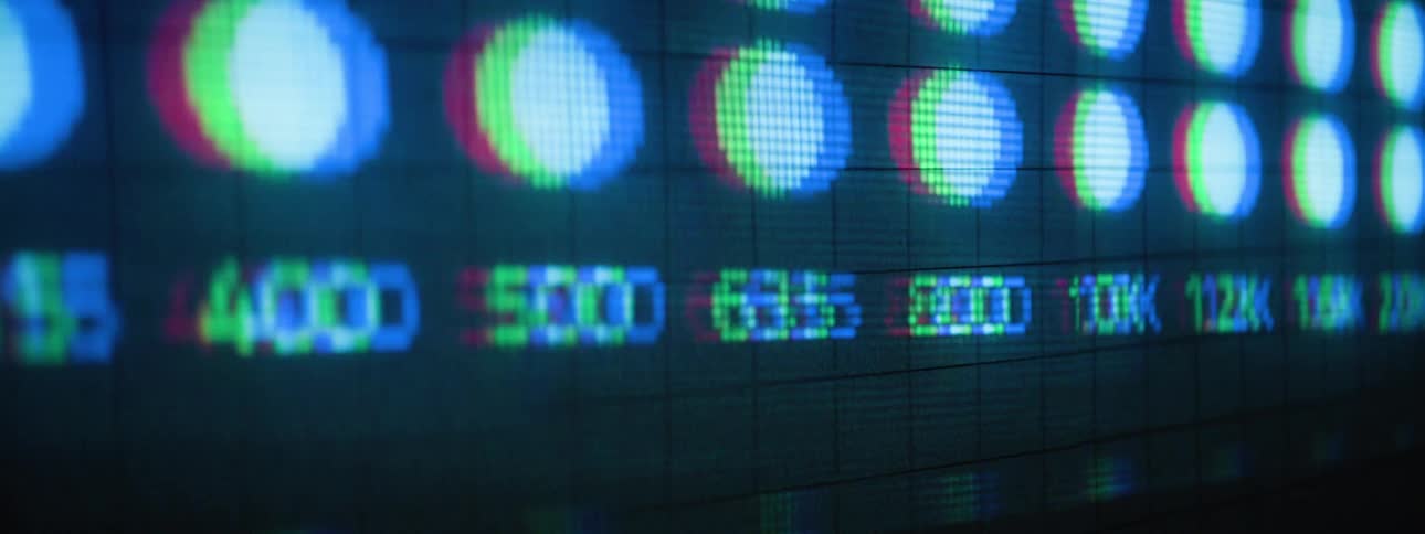 A pixelated display with numbers and blue circles