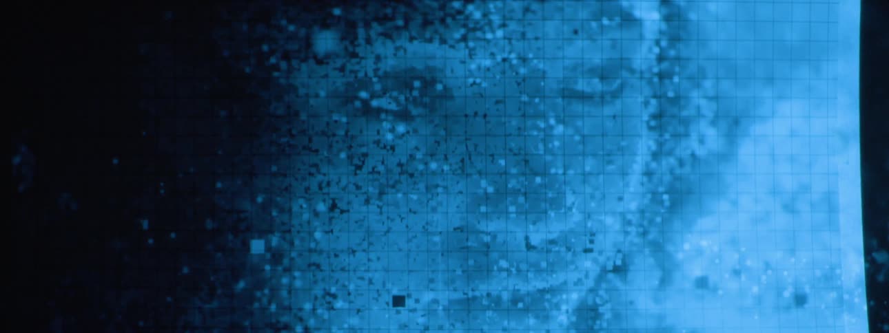 The animation of a persons face is projected on the wall