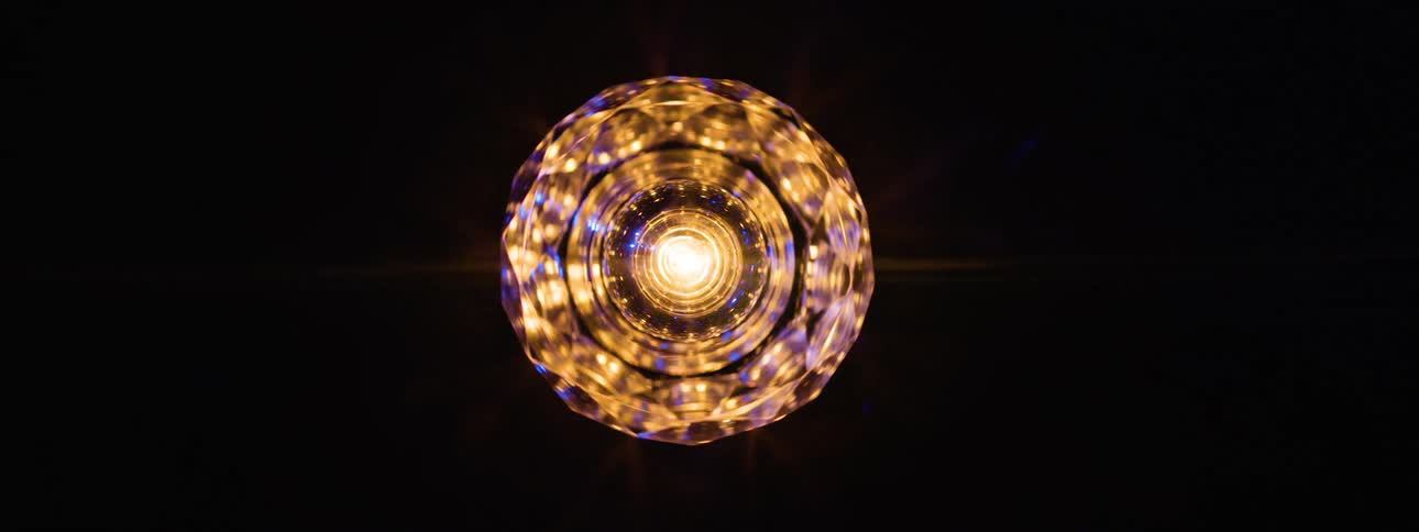 The light fixture spins in the dark