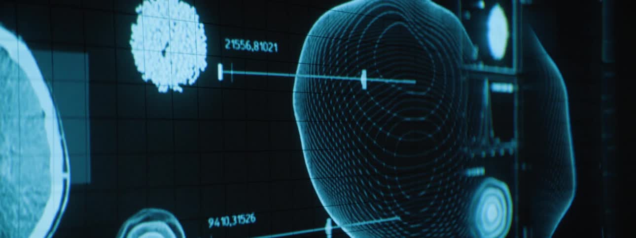 A projection on the wall shows numbers and orbs moving