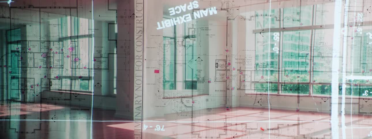 Blueprints overlay pictures of a building from the inside and outside