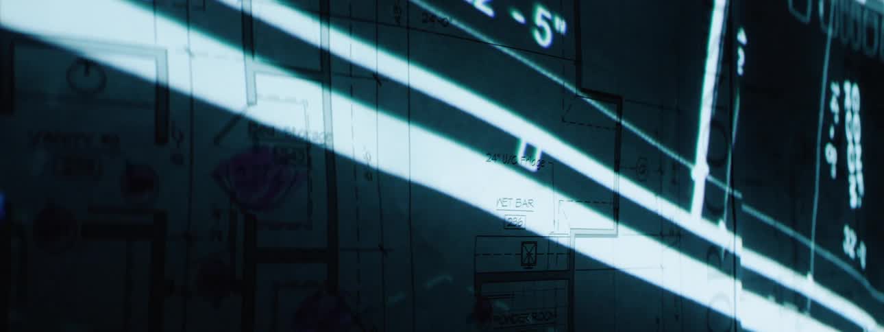 Monitors on their sides are displaying data