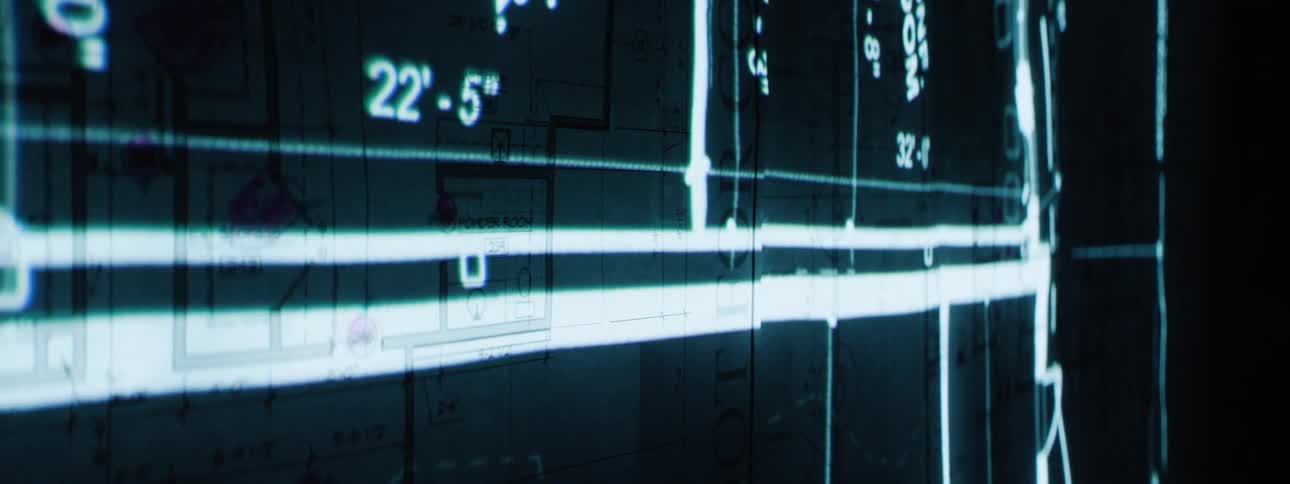 Blueprints are projected on the wall
