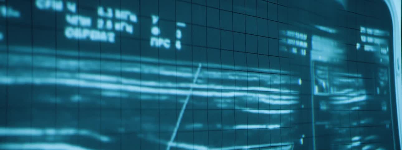 An image and information is projected on the wall in the dark