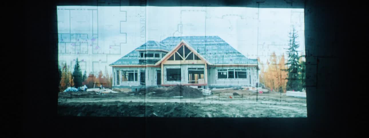 Images of blueprints and drawings of homes flash by