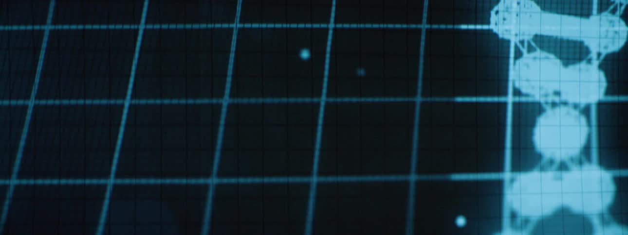A dna strand is spinning on the wall from a projector