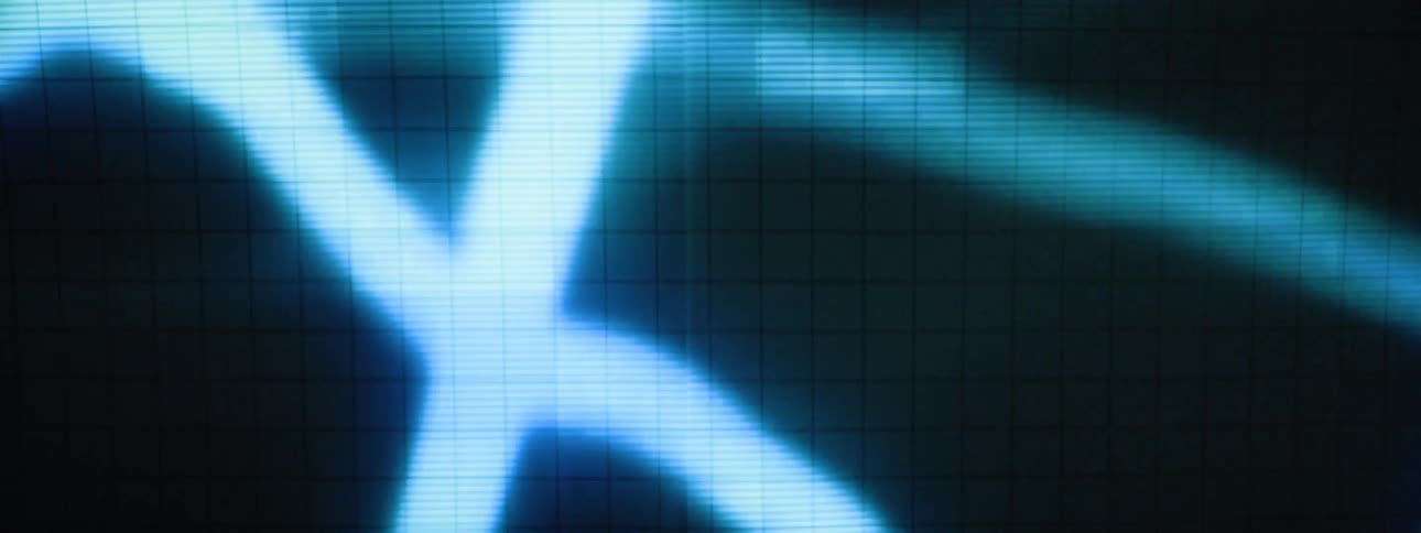 A digital screen flickering with distorted blue lines and numbers displayed underneath