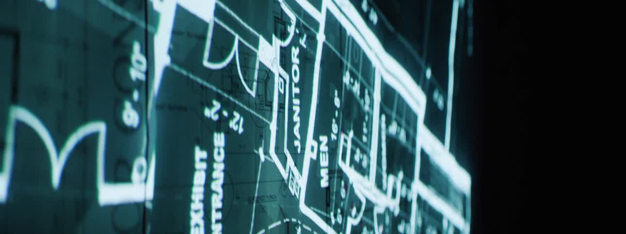 A digital image of a blueprint is on a monitor