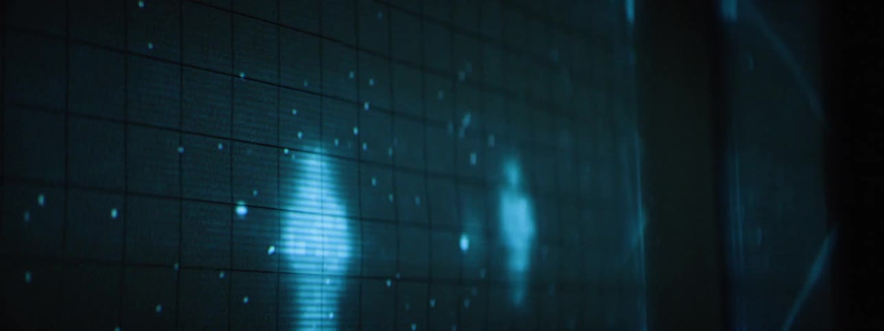 An animation of stars and figures with connecting lines project on the wall