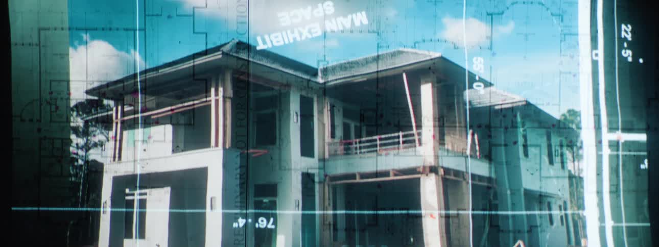 Blueprints are superimposed on pictures of home frames