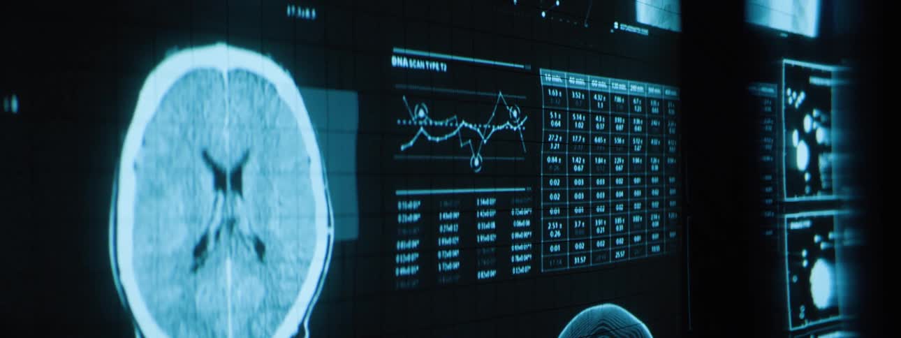Digital medical scan showing brain imaging and dna analysis on a futuristic screen