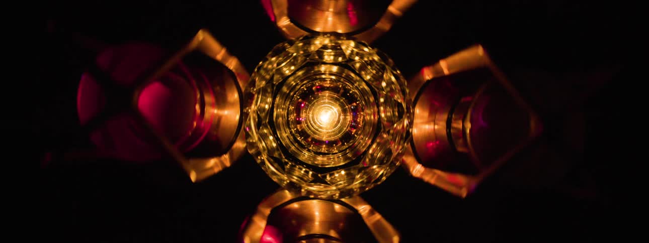 A chandelier rotating 360 degrees on the ceiling displaying flickering club lights