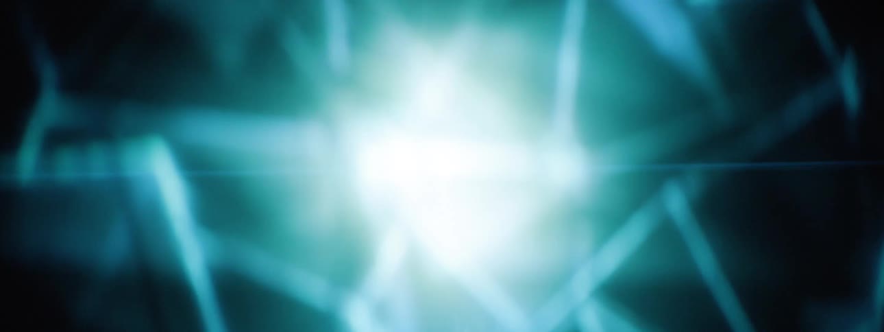 Light flares in the center of moving geometric shapes that are outlined in blue