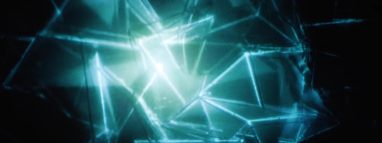 Light shines through moving shards in the animation
