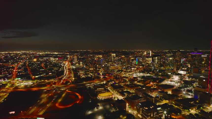 Traffic runs on the freeway in the city at night