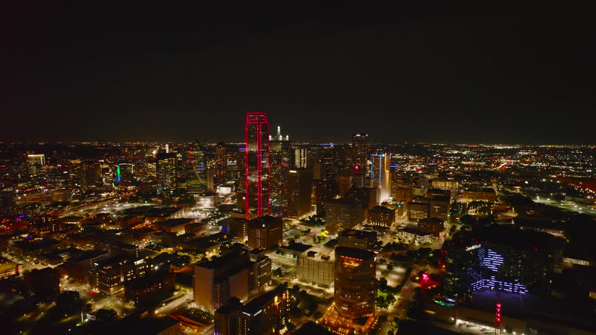 A large city at night with tall buildings