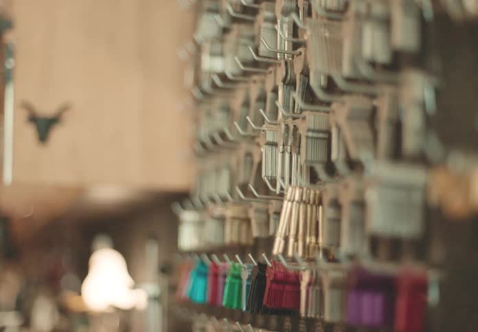 Many keys hanging on a wall