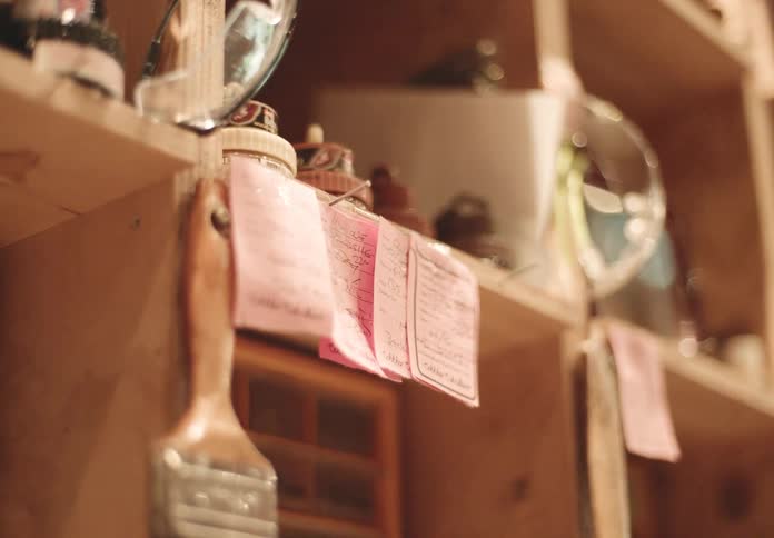 Objects sit in wooden cubbies