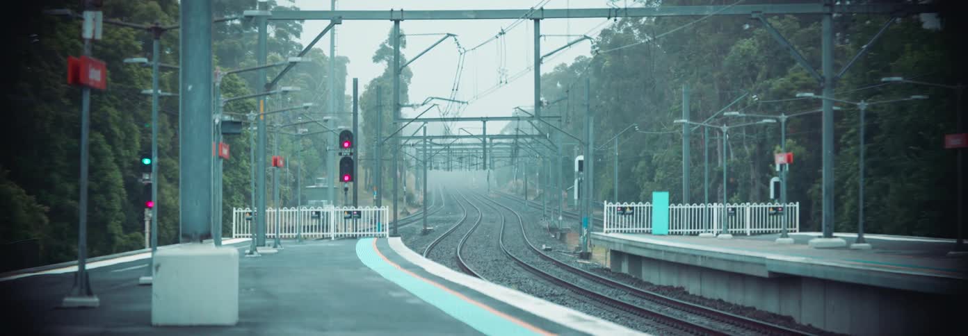 The train tracks are empty at the station
