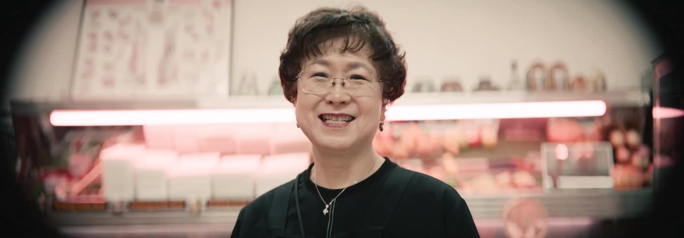 Lady in an establishment with happy facial expression