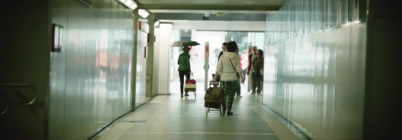 Travelers walk down the hallway in the train station