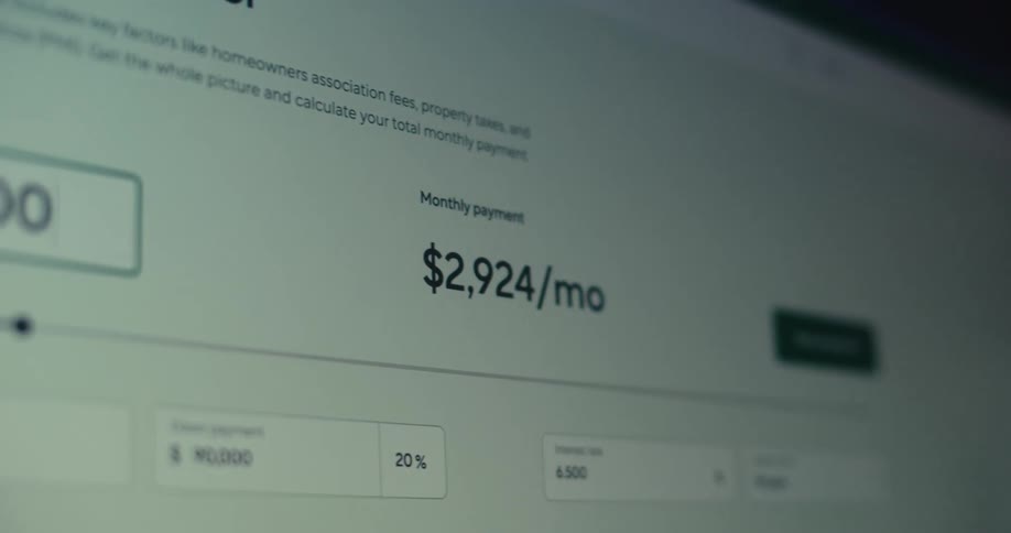 Monthly payment produced by a mortgage calculator displayed on a computerchanges as the home price is changed