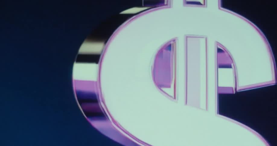 A large metallic gold dollar sign spins reflecting colors against a dark blue background